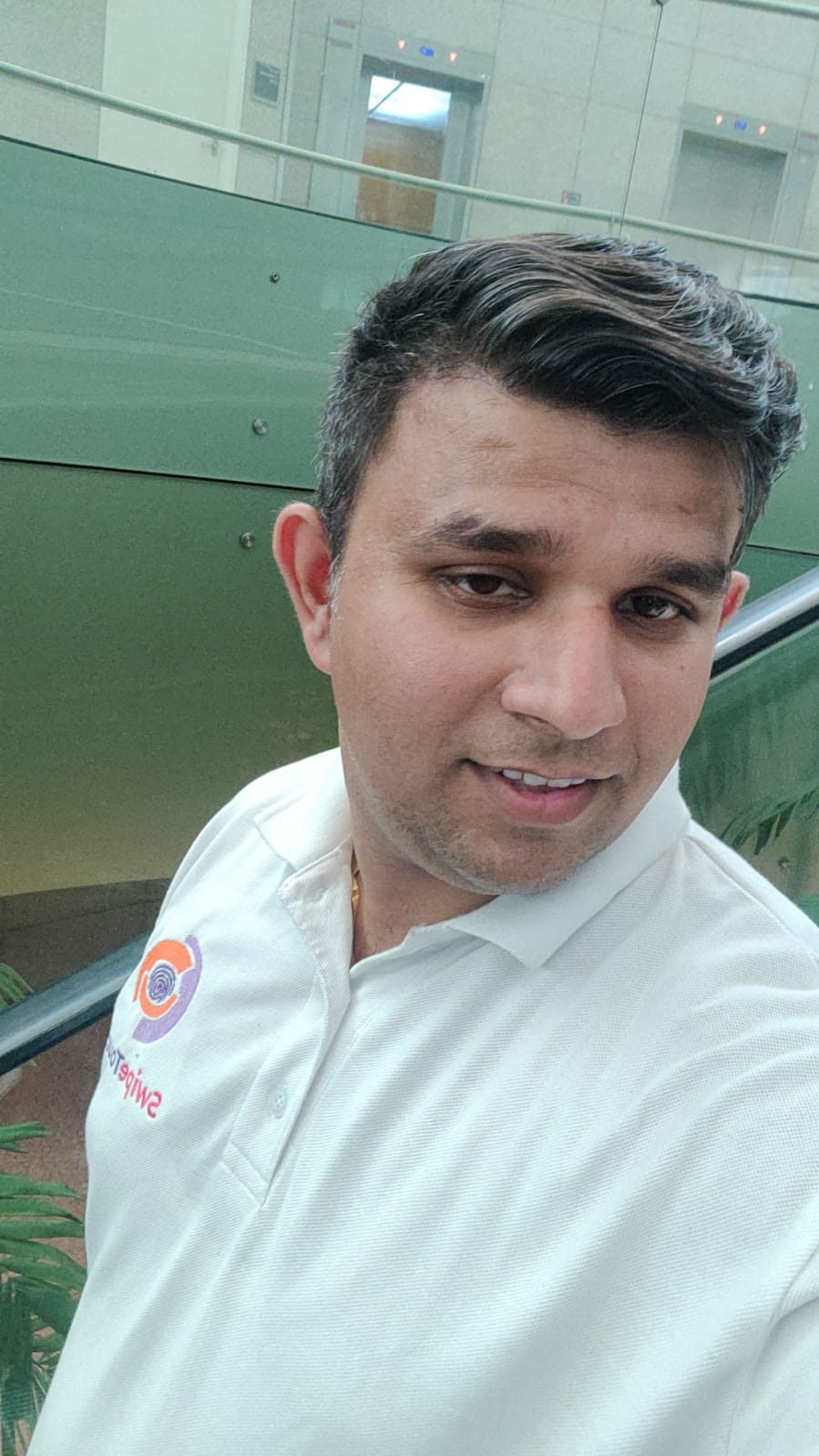 SwipeTouch team member in branded polo